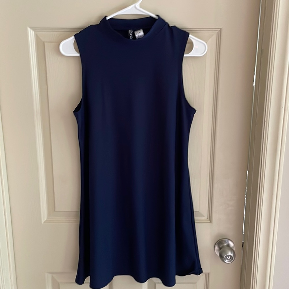 Adorable navy swing dress with mock neck.